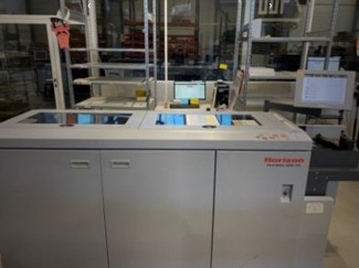 Creasing and sheet cutting machine